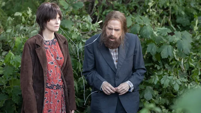 Bolan's Shoes: A woman and a bearded man share some headphones