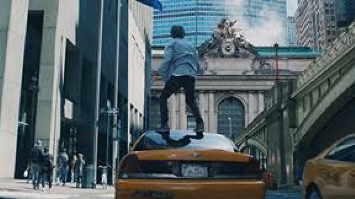 2:22: Dylan stands on a taxi