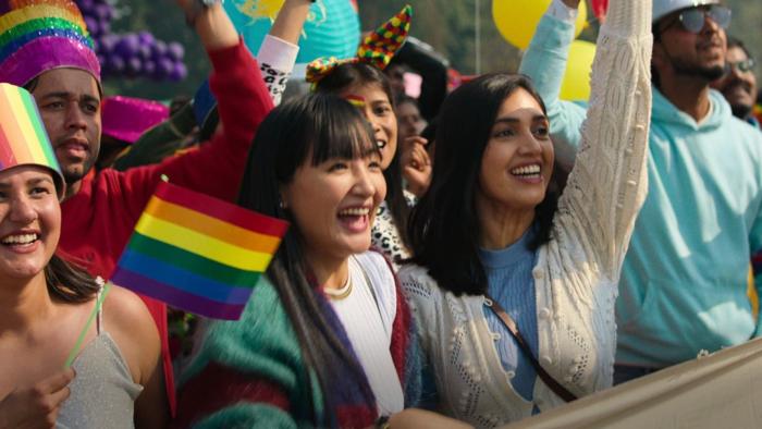 Badhaai Do: Characters having a great time at a Pride parade, waving rainbow flags..