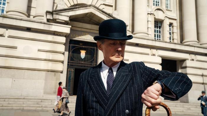 Living: Bill Nighy checking the time.
