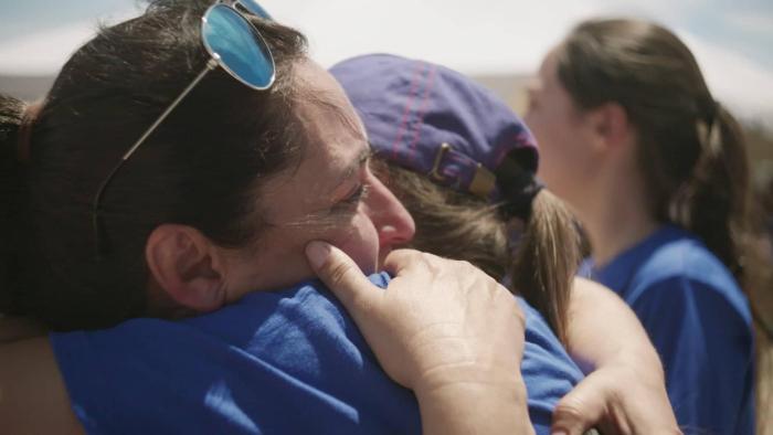 A 3 Minute Hug Movie: A woman hugs a loved one