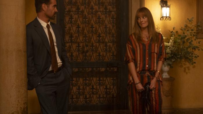 A Big Bold Beautiful Journey movie: Colin Farrell and Margot Robbie stand in a room together, smiling at each other