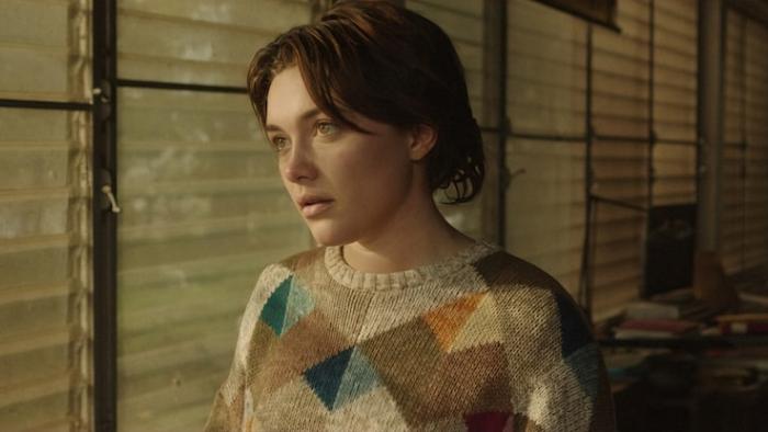 A Good Person Movie: The light shines on Florence Pugh as she looks out a window
