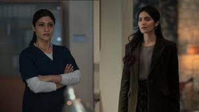 Accused: Two Indian women, one in scrubs and the other in a jacket
