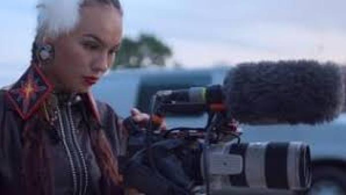 Against the Current Movie: Native American girl looks into camera