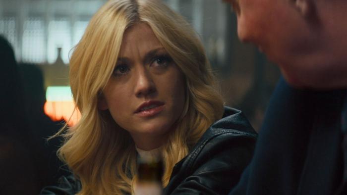 Air Force One Down Movie: Allison Miles (Katherine McNamara) talks with her Uncle Sam (Anthony Michael Hall, mostly off-camera) in a bar, with a questioning look on her face