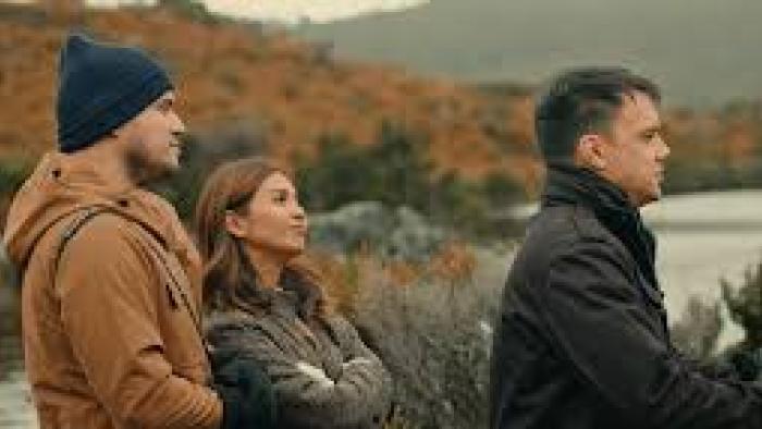 A Journey Movie: Asian woman and Asian men stand outside