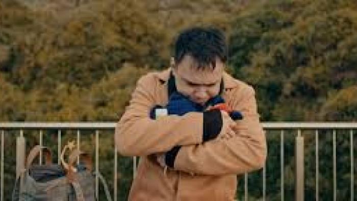 A Journey Movie: Asian man clutches himself