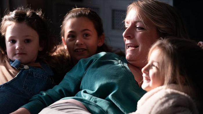 Ali & Ava: Claire Rushbrook on the sofa with four grandchildren around her.