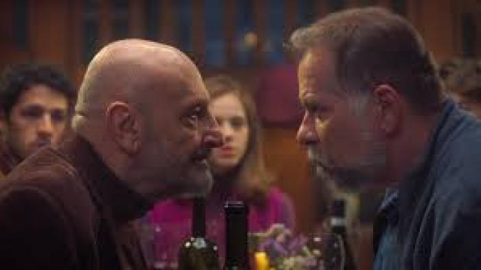 Almost Family: Older man leans menacingly at other man