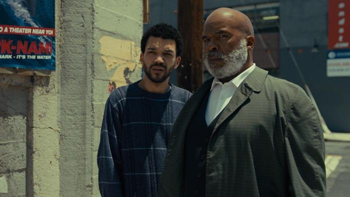 The American Society of Magical Negroes Movie: Justice Smith and David Alan Grier are on sidewalk, confused