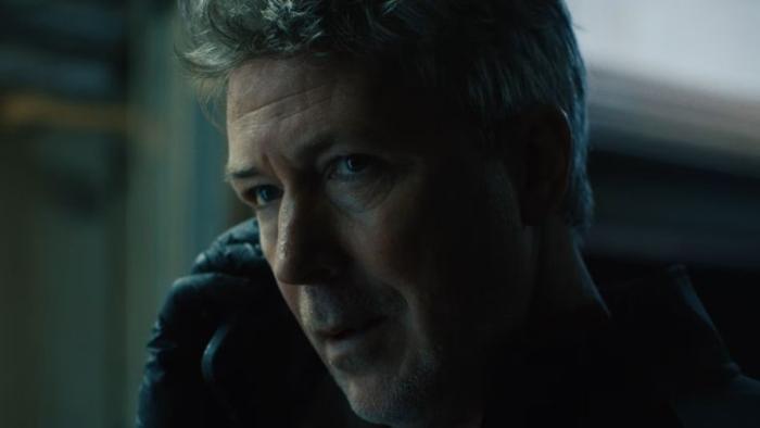 Amongst the Wolves: A gray-haired White man talks on his cellphone