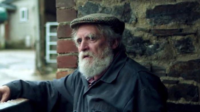 And Then Come the Nightjars: David Fielder with a white beard and flat cap looks sad