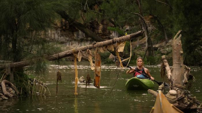 Apex: Charlize Theron in a kayak.