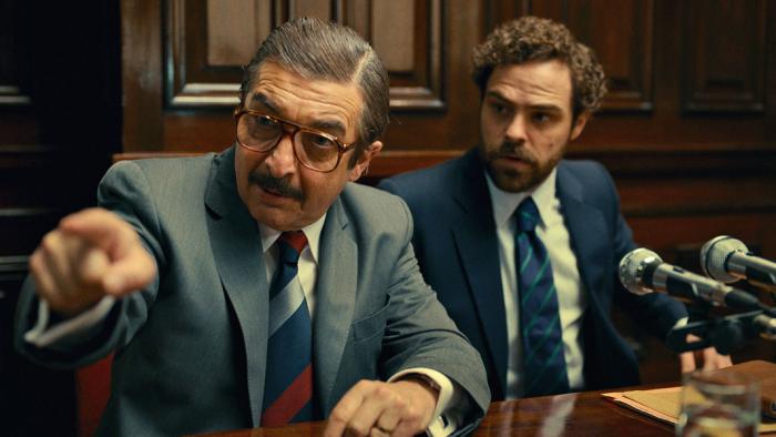 Argentina, 1985: Two Argentinian men in court, one middle-aged and one younger. Both are prosecutors. The older man points accusingly