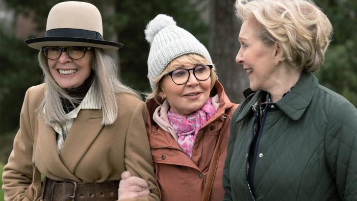 Arthur's Whisky: Diane Keaton, Lulu, and Patricia Hodge smile as they walk arm in arm.