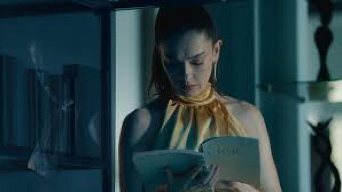 Ashes: A woman in a yellow dress