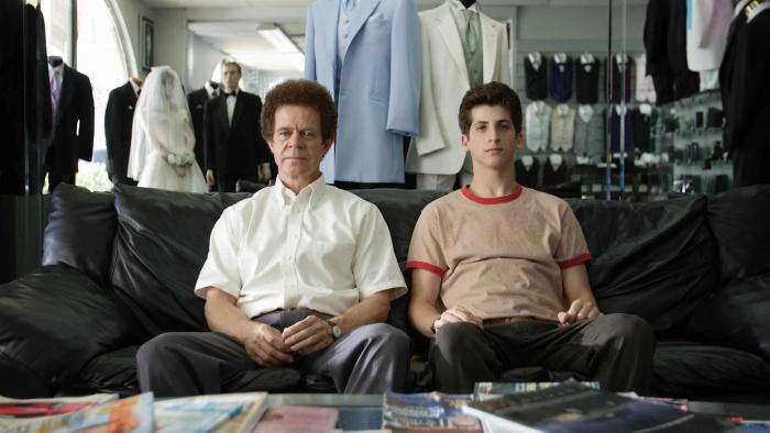 Bart Got a Room: A father and son sit next to each other, facing forward, in a tuxedo shop