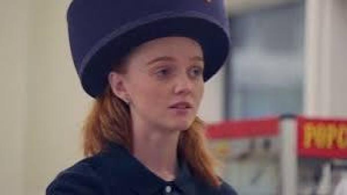 Before the Ice Melts movie: Molly Peyton wearing a large blue hat indoors.