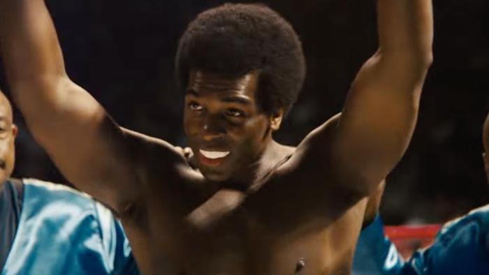 Big George Foreman Movie: Khris Davis as George Foreman, raising his arms in celebration