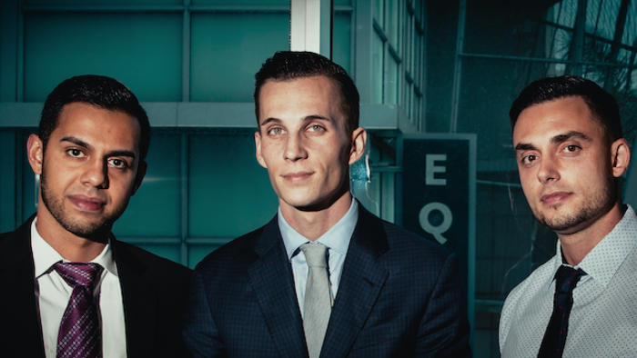 Still from Bitconned: From left to right, Sam "Sorbee" Sharma, Centra Tech's president and co-founder, Raymond Trapani, Centra Tech's chief operating officer and co-founder, and Robert Farkas, Centra Tech's chief financial officer and co-founder face the camera, wearing business suit attire 