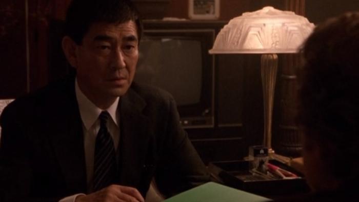  Black Rain: Ken Takakura sits at table