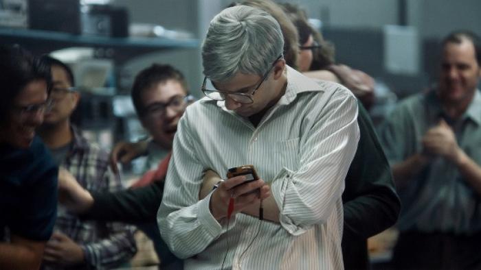 BlackBerry Movie: Jay Baruchel looks at his BlackBerry invention amid a crowd of his employees