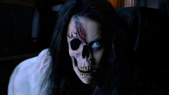 Urban Legend—Bloody Mary: A scary, ghostly figure with a skeletal mouth, scarring on her forehead, and an eye missing stares straight ahead