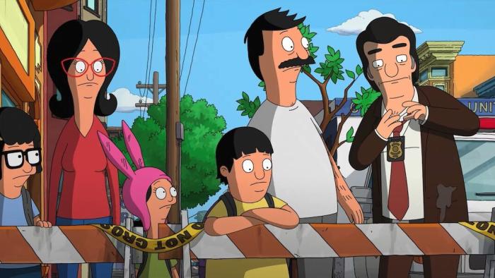 The Bob's Burgers Movie: A family standing behind caution gate