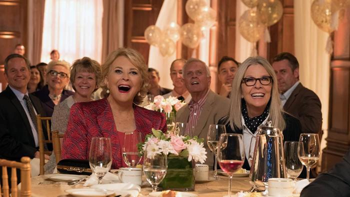 Book Club Movie: Sharon and Diane sitting at a fancy event