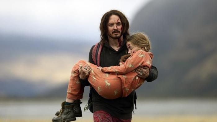 Bookworm movie: Strawn carries Mildred; both are bloodied