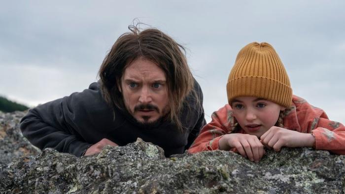 Bookworm movie: Strawn and Mildred crouch behind rocks