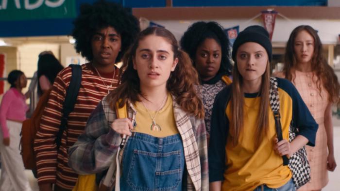 Bottoms Movie: The fight club is grouped together in a school gym, staring at the camera