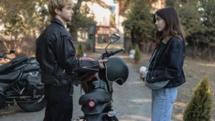 Boulevard: Eve Ryan and Mikel Niso by a motorcycle.