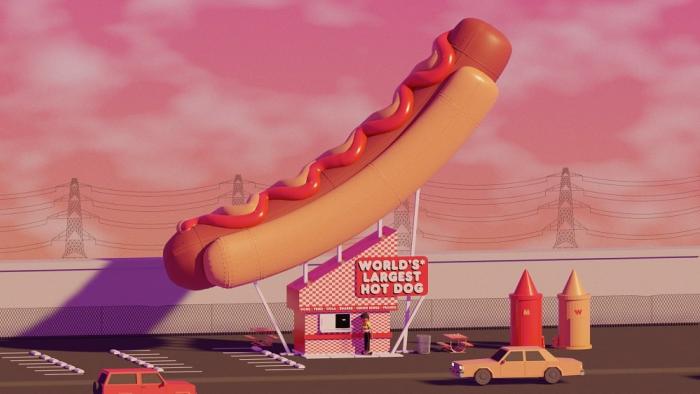 Boys Go to Jupiter movie: Billy stands outside a hot dog stand with the world's largest hot dog on top