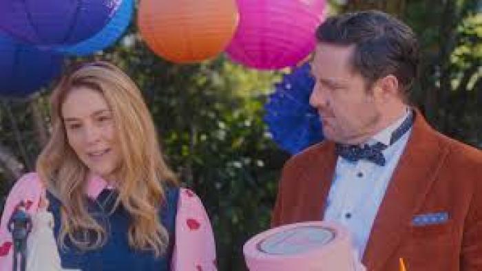 Bride of the Year: Man in red jacket and woman in pink, surrounded by colorful paper lanterns.