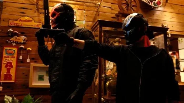 Bring Him to Me: Two masked men hold up a gun during a robbery