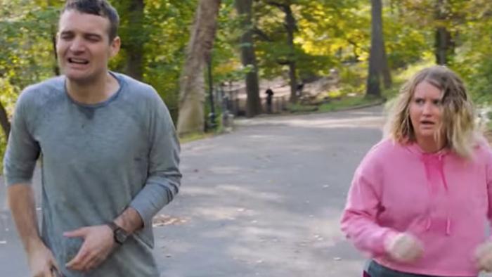 Brittany Runs a Marathon Movie: Brittany and Seth run together down a park pathway, looking sweaty and exhausted. 