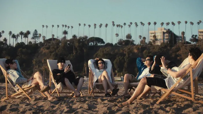BTS: The Return: Band at the beach.