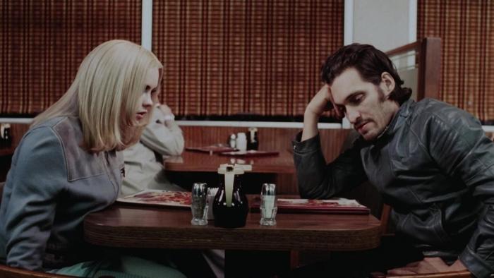 Buffalo 66: A man and woman sit in a diner booth looking at a menu