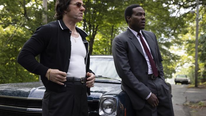 By Any Means Movie: Scarpa and Strider lean on a car, as if preparing to question another witness or suspect