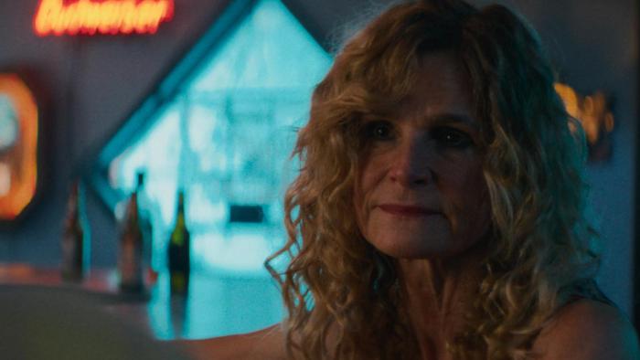 Carolina Caroline movie: Caroline's estranged mother (Kyra Sedgwick) sits in a bar