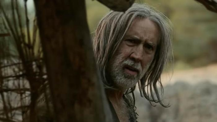 The Carpenter's Son Movie: The Carpenter (Nicolas Cage) peers suspiciously around a corner