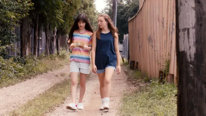 Casey Makes a Mixtape: Kennedy Celeste and Presley Richardson walk down an alley.