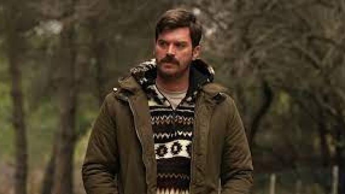 Chokehold: A Turkish man walks in the woods