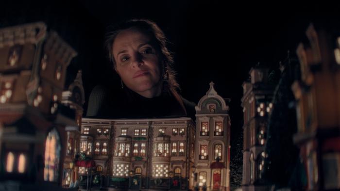 Christmas Eve in Miller's Point Movie: Looming over a model Christmas village, Kathleen (Maria Dizzia) looks sad