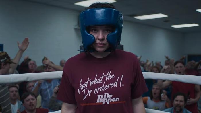 Christy movie: Sydney Sweeney as boxer Christy Martin training in the ring, wearing a boxing helmet and a Dr. Pepper T-shirt