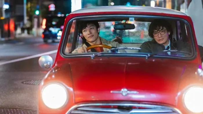 City Hunter movie: Japanese men sit in front seats of red car while driving