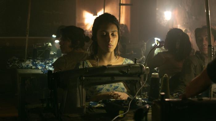 City of Dreams Movie: Elena (Renata Vaca) works at a sewing machine in a sweat shop