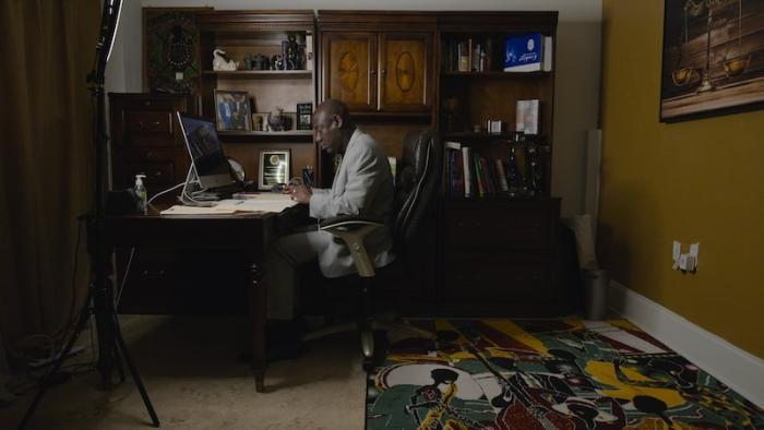 Attorney Ben Crump seated in office